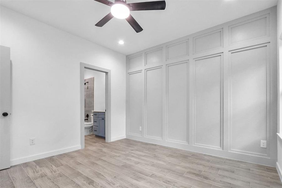 Unfurnished bedroom with light wood-type flooring, ensuite bath, recessed lighting, and ceiling fan Unfurnished bedroom with light wood-type flooring, ensuite bath, recessed lighting, and ceiling fan