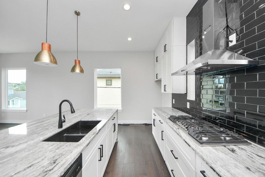 Kitchen showcasing ample cabinetry and counter space