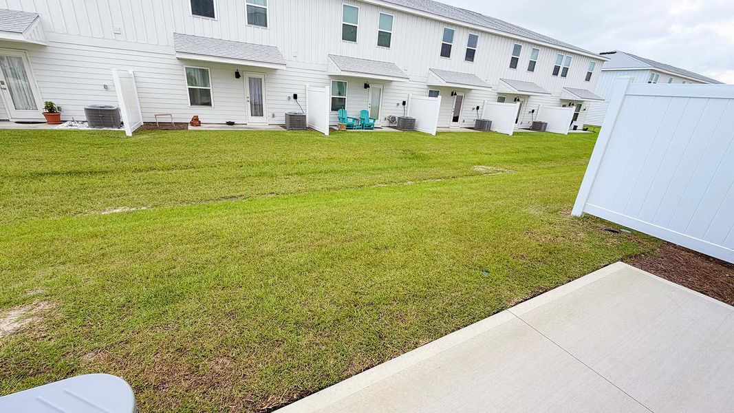 Exterior details and patio area of a home in Salt Creek Townhomes at Mexico Beach, Mexico Beach (Image 21).