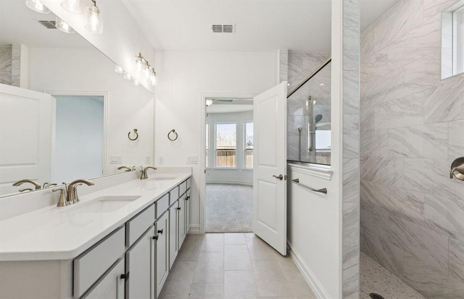 Deep walk-in shower designed for relaxation in the owner's bath *Real home pictured Deep walk-in shower designed for relaxation in the owner's bath *Real home pictured