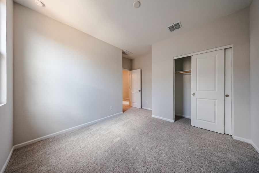 A hallway with white doors.
