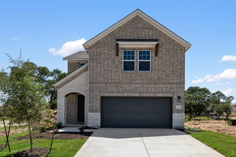 Front exterior of a new home in The Cottages at La Cima, San Marcos, TX, highlighting curb appeal (Image 2). Front exterior of a new home in The Cottages at La Cima, San Marcos, TX, highlighting curb appeal (Image 2).