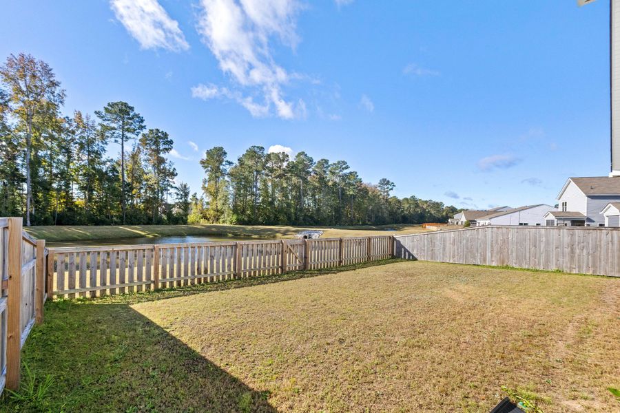 Exterior details and patio area of a home in K. Hovnanian's® Four Seasons at Lakes of Cane Bay, Summerville (Image 23). Exterior details and patio area of a home in K. Hovnanian's® Four Seasons at Lakes of Cane Bay, Summerville (Image 23).