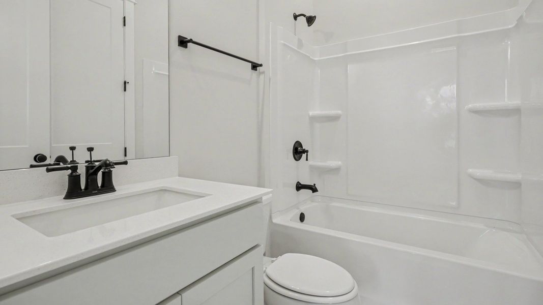Secondary bathroom with single vanity