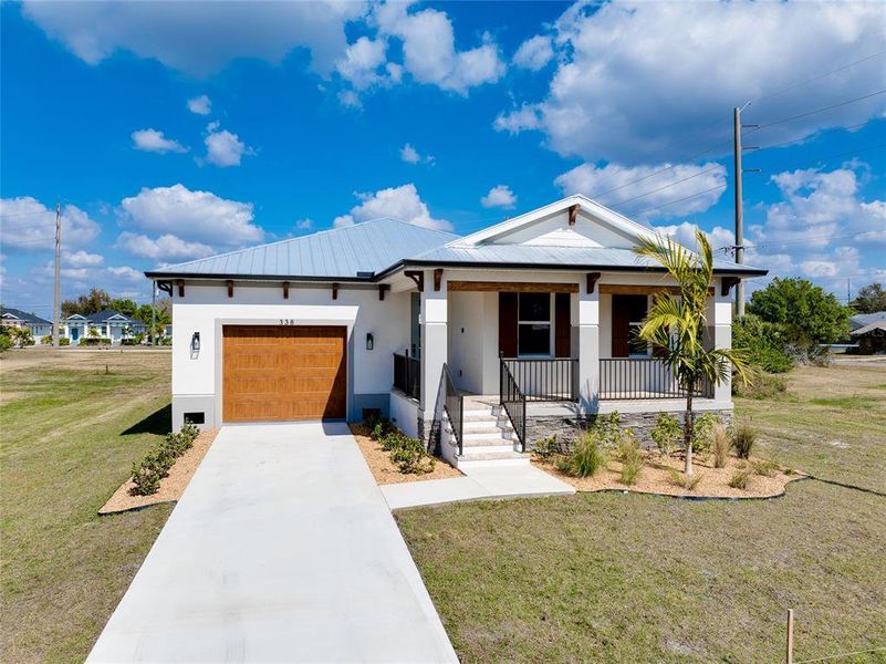 Front exterior of a new home in , Punta Gorda, FL, highlighting curb appeal (Image 2). Front exterior of a new home in , Punta Gorda, FL, highlighting curb appeal (Image 2).
