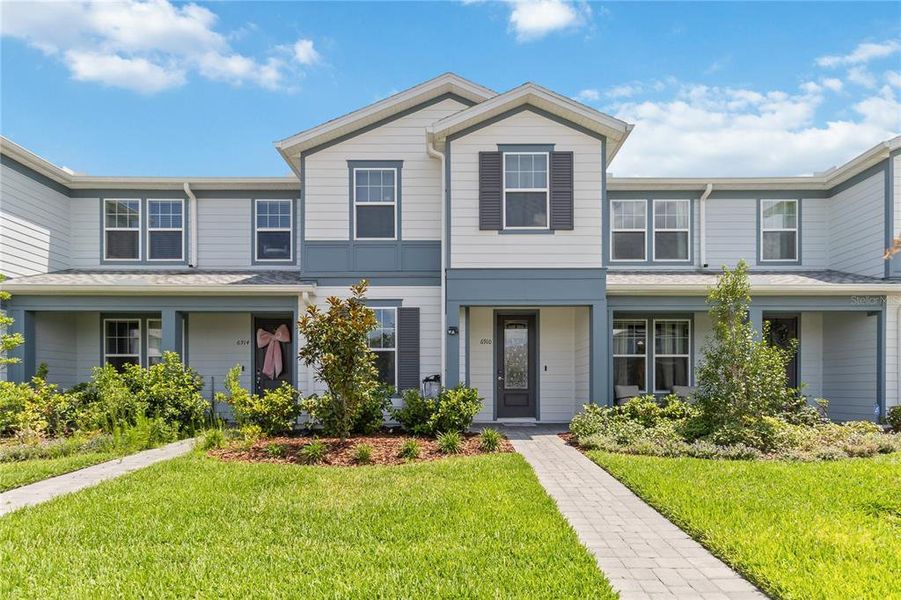 Front exterior of a new home in , Orlando, FL, highlighting curb appeal (Image 1). Front exterior of a new home in , Orlando, FL, highlighting curb appeal (Image 1).