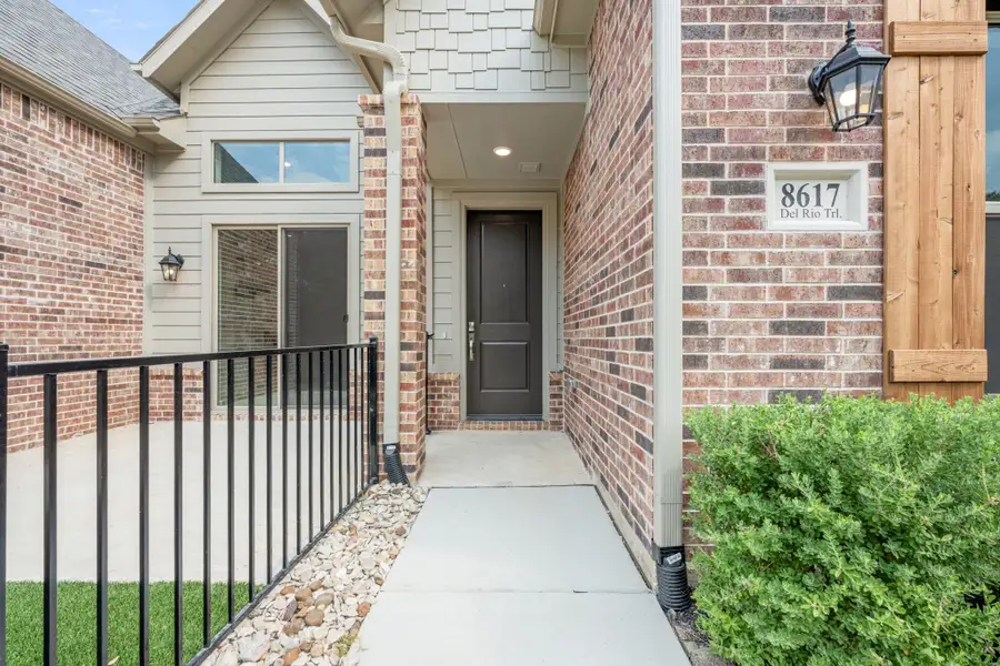 Exterior details and patio area of a home in Cottonwood Creek, Rowlett (Image 30).