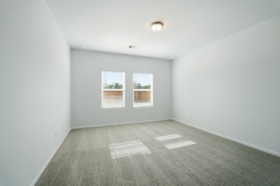 Spacious, unfurnished interior of a new home in The Pines at Seven Coves, Willis (Image 23).