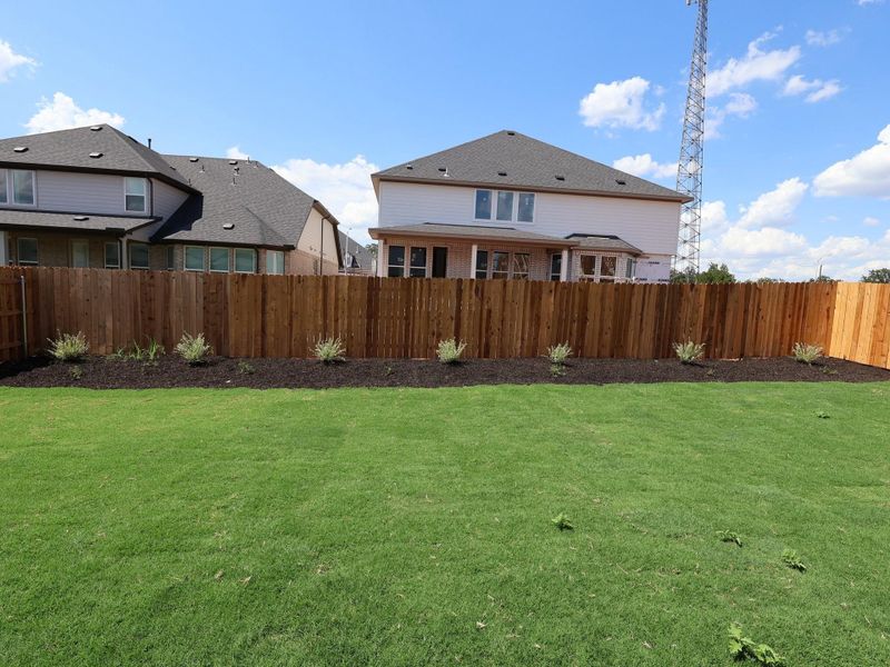 Front exterior of a new home in Edgewood, Leander, TX, highlighting curb appeal (Image 2). Front exterior of a new home in Edgewood, Leander, TX, highlighting curb appeal (Image 2).