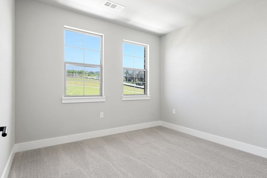 Spacious, unfurnished interior of a new home in The Tribute, The Colony (Image 38).