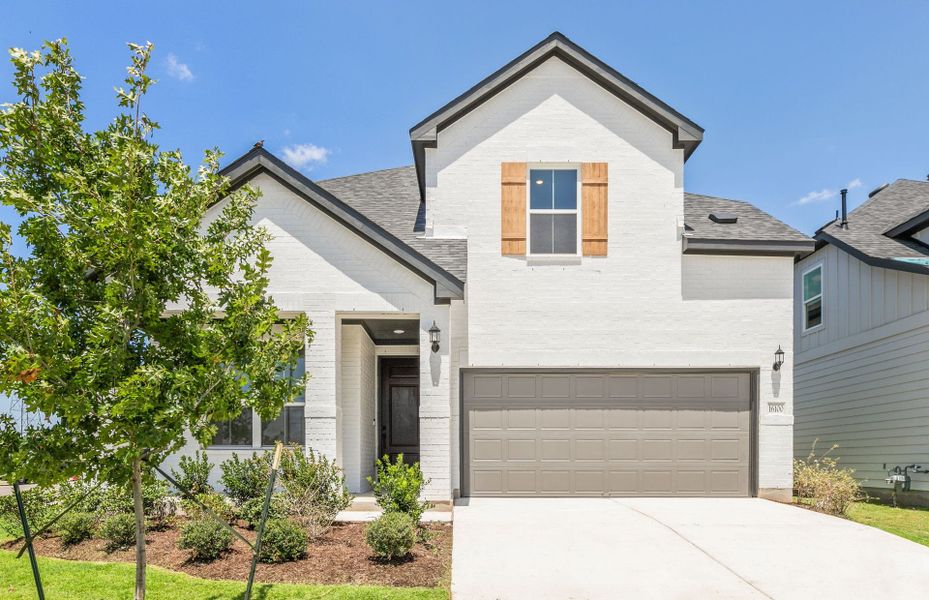 Front exterior of a new home in Kuempel Farms, Pflugerville, TX, highlighting curb appeal (Image 21).