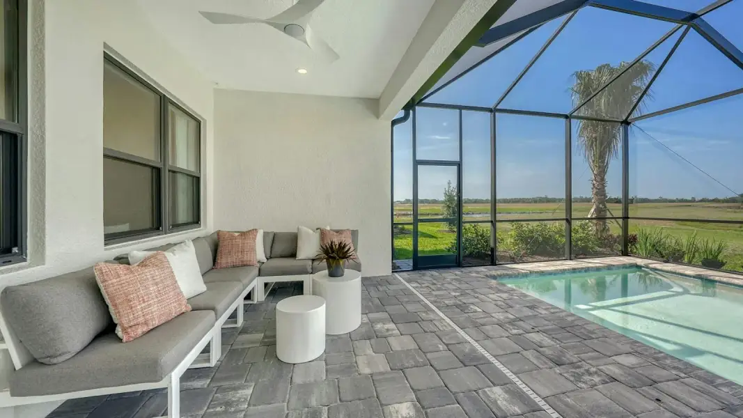 Exterior details and patio area of a home in Kingston South Real Estate and Homes for Sale in Estero, FL - Neal Communities, Estero (Image 4).