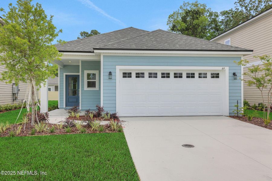 Front exterior of a new home in TrailMark, St. Augustine, FL, highlighting curb appeal (Image 23). Front exterior of a new home in TrailMark, St. Augustine, FL, highlighting curb appeal (Image 23).