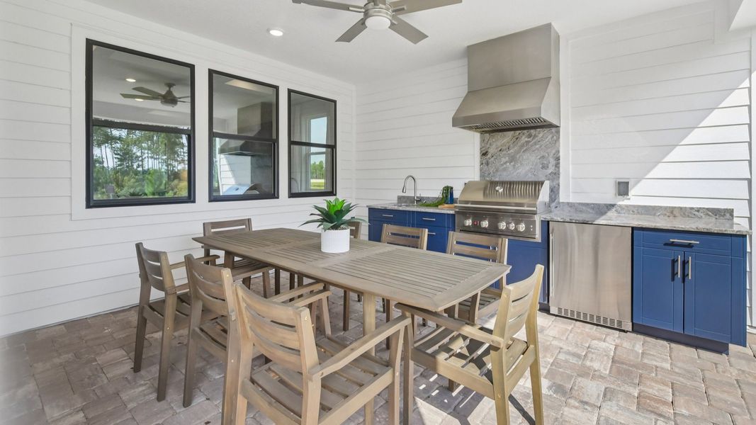 Summer Kitchen and Outdoor Seating Area of the Marigold Floor Plan at Haven at Diamond Springs