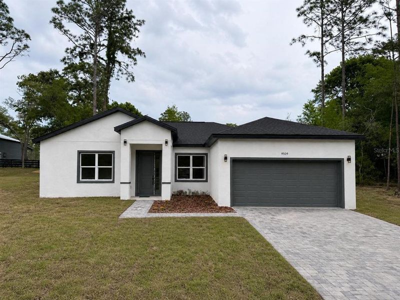 Front exterior of a new home in , Citrus Springs, FL, highlighting curb appeal (Image 1). Front exterior of a new home in , Citrus Springs, FL, highlighting curb appeal (Image 1).