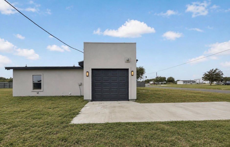 Front exterior of a new home in , Donna, TX, highlighting curb appeal (Image 15).