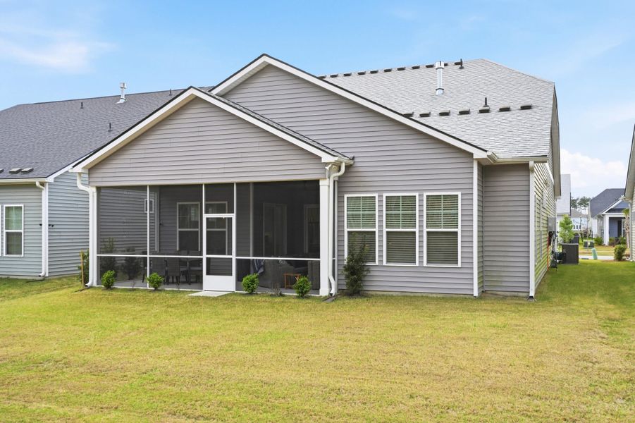 Exterior details and patio area of a home in Summerwind Crossing at Lakes of Cane Bay, Summerville (Image 26).