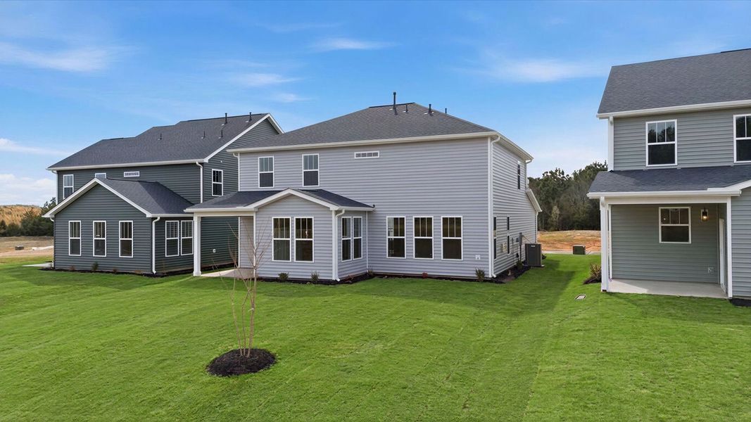Accomplished exterior with a spacious rear porch that blends comfort and style at Foxbank in Gray Court, SC