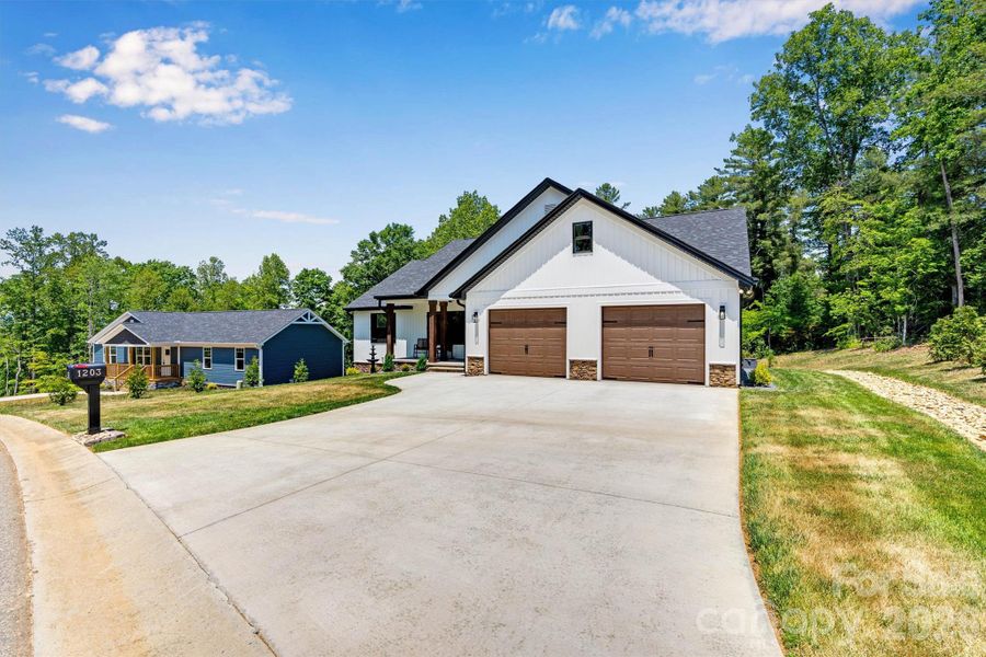 Front exterior of a new home in , Lenoir, NC, highlighting curb appeal (Image 23).