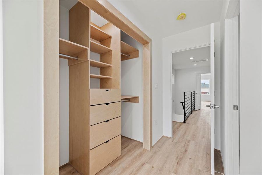 Each of the bedrooms have their own dedicated custom closet space along with built-in shelving.