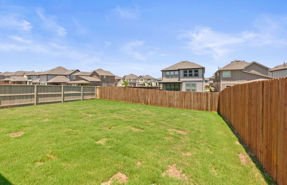 Front exterior of a new home in Saddleback at Santa Rita Ranch, Liberty Hill, TX, highlighting curb appeal (Image 18).