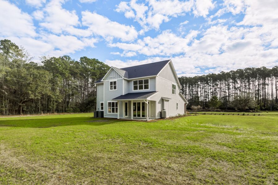 Exterior details and patio area of a home in , Johns Island (Image 37).