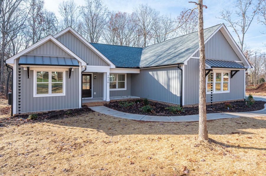 Front exterior of a new home in , Newton, NC, highlighting curb appeal (Image 20).