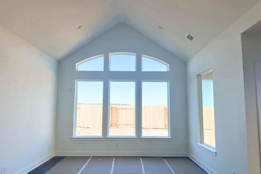 Unfurnished room with vaulted ceiling Unfurnished room with vaulted ceiling