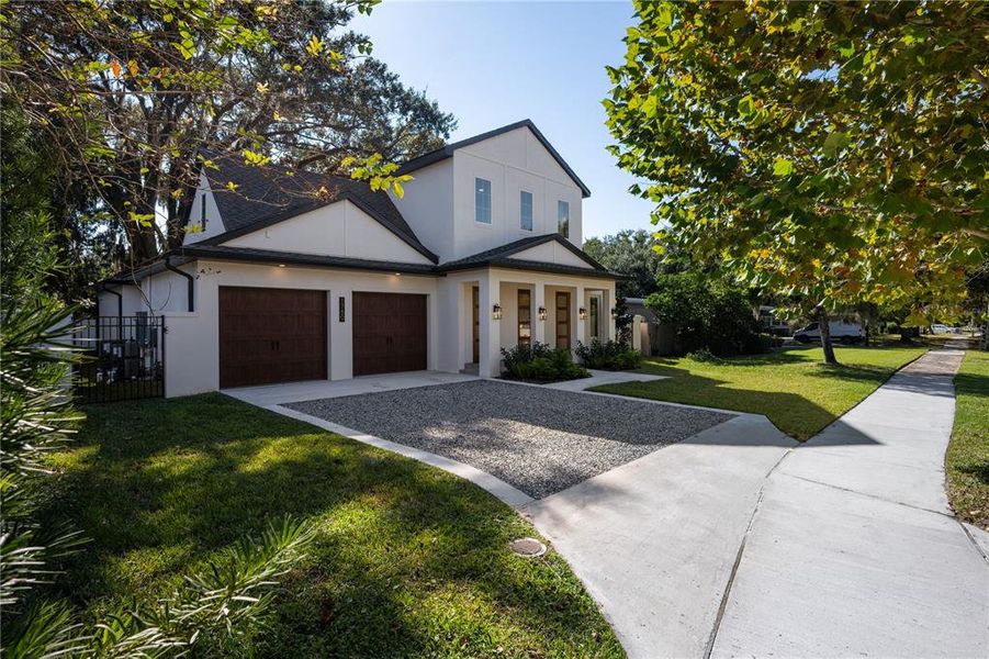 Front exterior of a new home in , Winter Park, FL, highlighting curb appeal (Image 24).