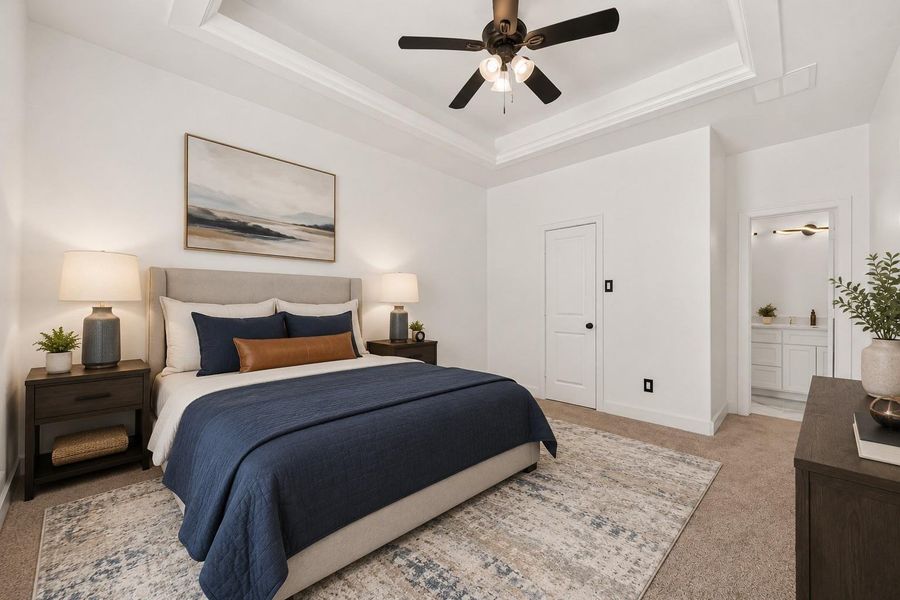 Second generously sized primary bedroom offers exceptional flexibility for homeowners and guests. Virtually staged.