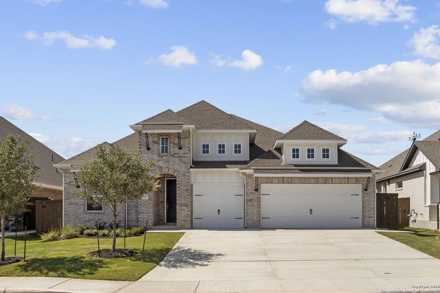 Front exterior of a new home in Stillwater Ranch 60', San Antonio, TX, highlighting curb appeal (Image 18).