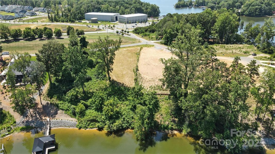 This is your opportunity to create a lakeside retreat that feels a world away—but is close to everything