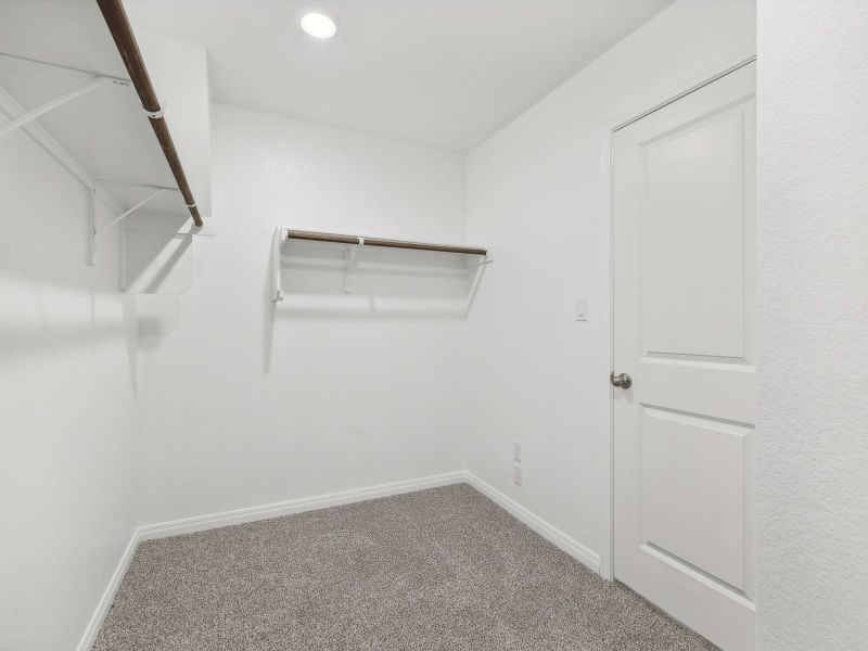 There's plenty of room for clothes and storage in the primary bedroom closet.