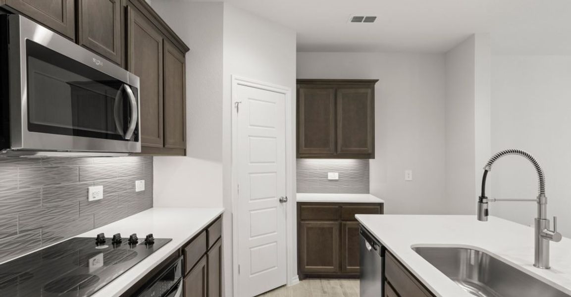 Representative exterior photo of a completed home built from the Hickory by Impression Homes in ValleyBrooke, Mesquite, TX (Image 6).