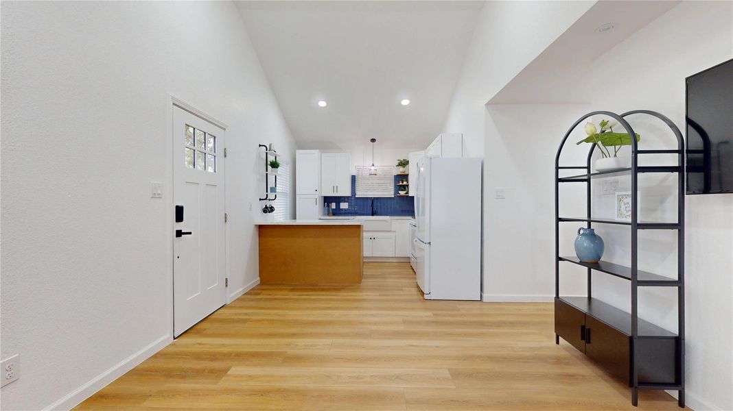Recessed lighting throughout the kitchen & living area