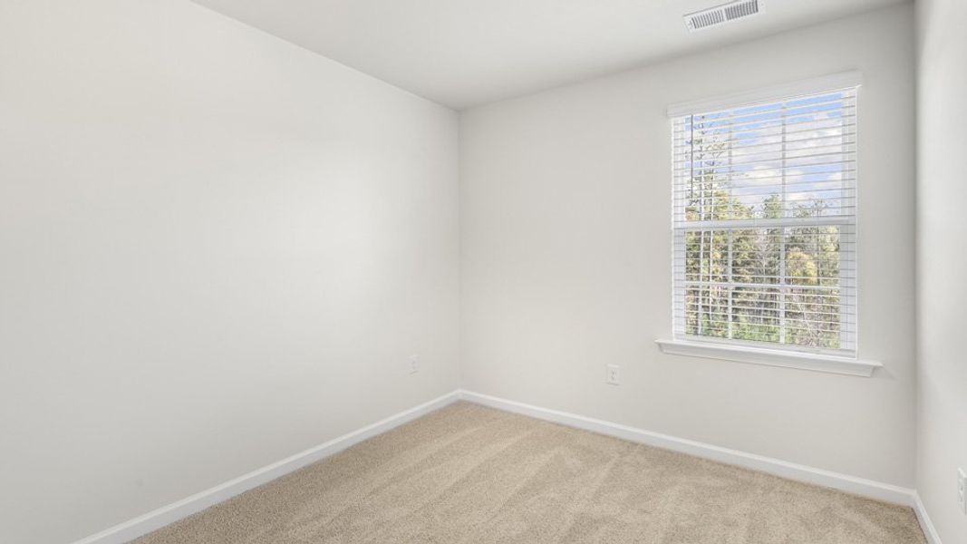 Spacious, unfurnished interior of a new home in The Townes at Galvins Ridge, Sanford (Image 20).