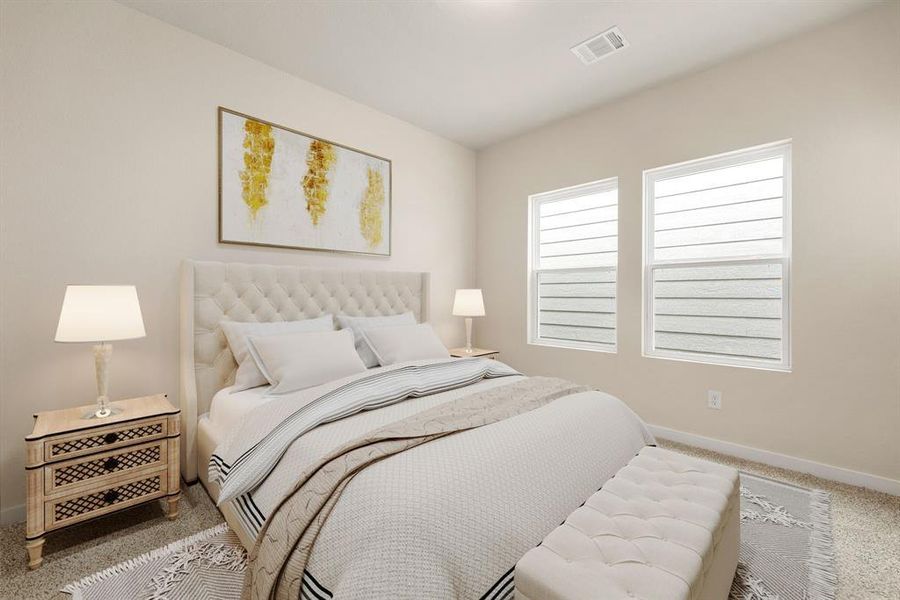 Secondary bedroom features plush carpet, neutral paint, large windows and ample closet space.