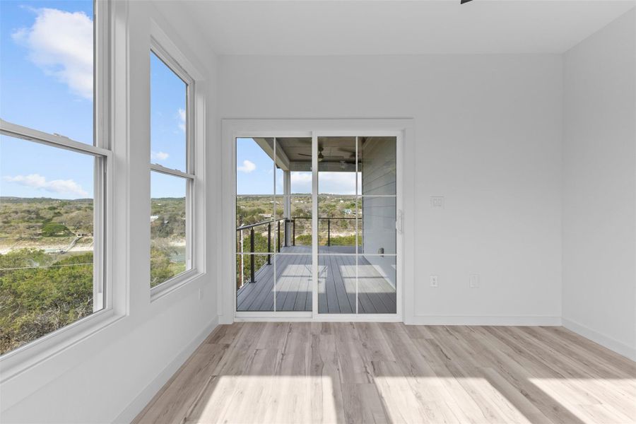 Unfurnished office with wood finished floors and plenty of natural light