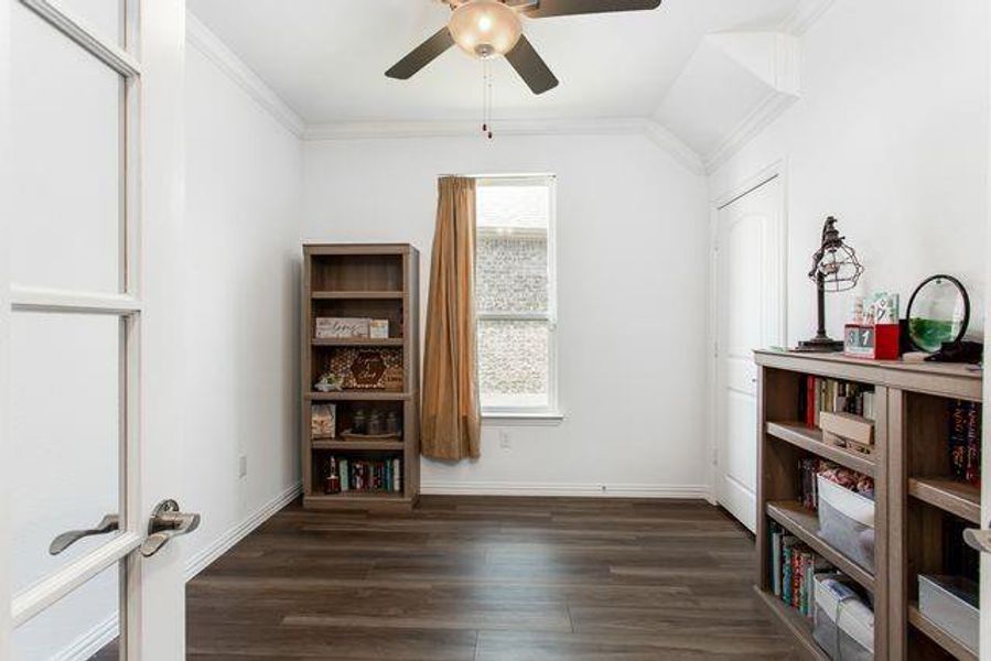 Office featuring ceiling fan and wood finished floors.