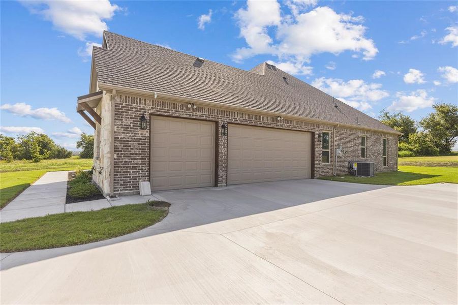 Front exterior of a new home in , Godley, TX, highlighting curb appeal (Image 2). Front exterior of a new home in , Godley, TX, highlighting curb appeal (Image 2).