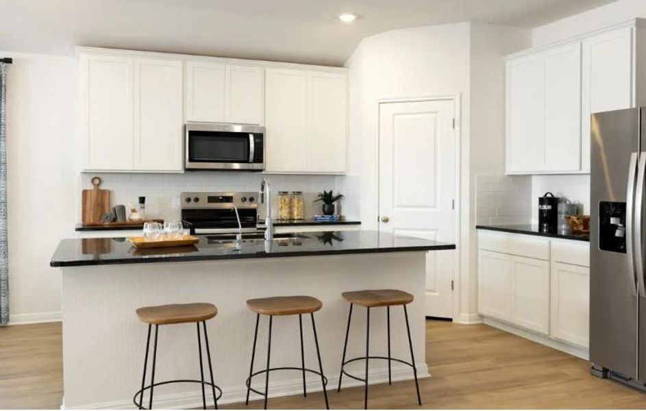 Photo is not of the actual home, but is an inspirational photo of builder’s model home and may depict options, furnishings, and/or decorator features that are not included