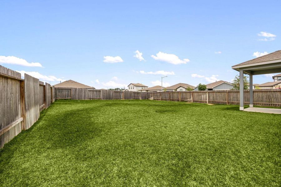 Exterior details and patio area of a home in Granger Pines, Conroe (Image 23).
