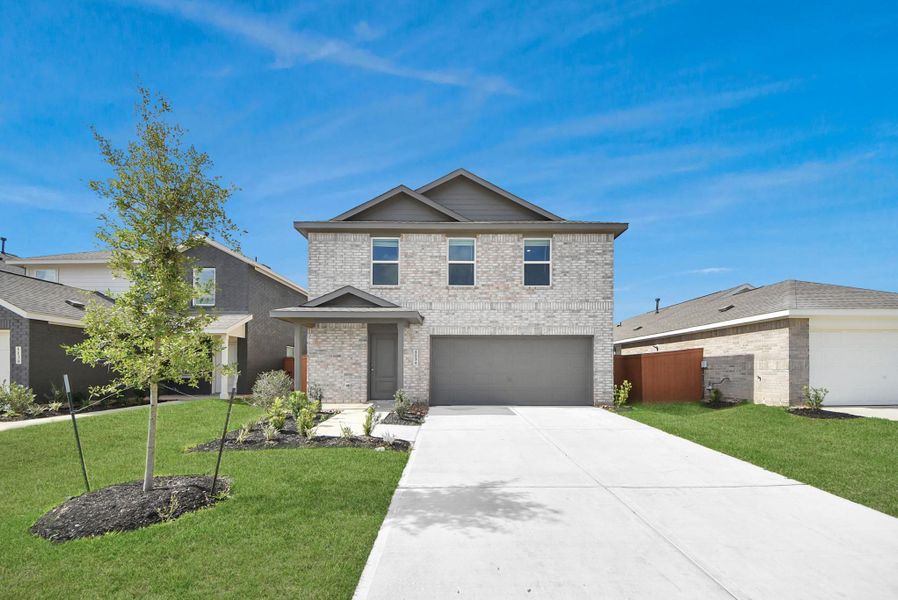 Front exterior of a new home in Emberly, Beasley, TX, highlighting curb appeal (Image 22). Front exterior of a new home in Emberly, Beasley, TX, highlighting curb appeal (Image 22).