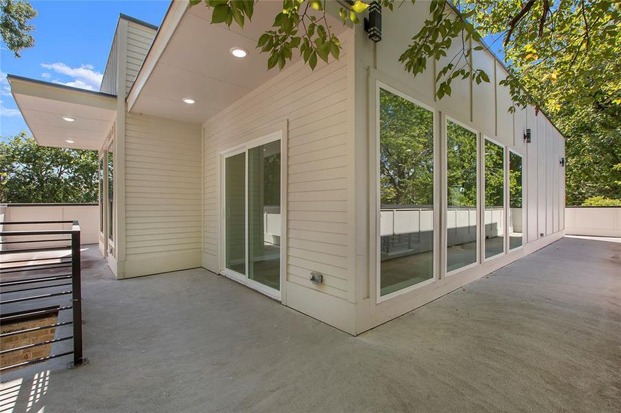 View of property exterior with a patio