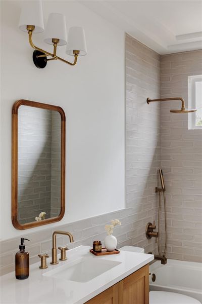 Bathroom featuring vanity and tub / shower combination