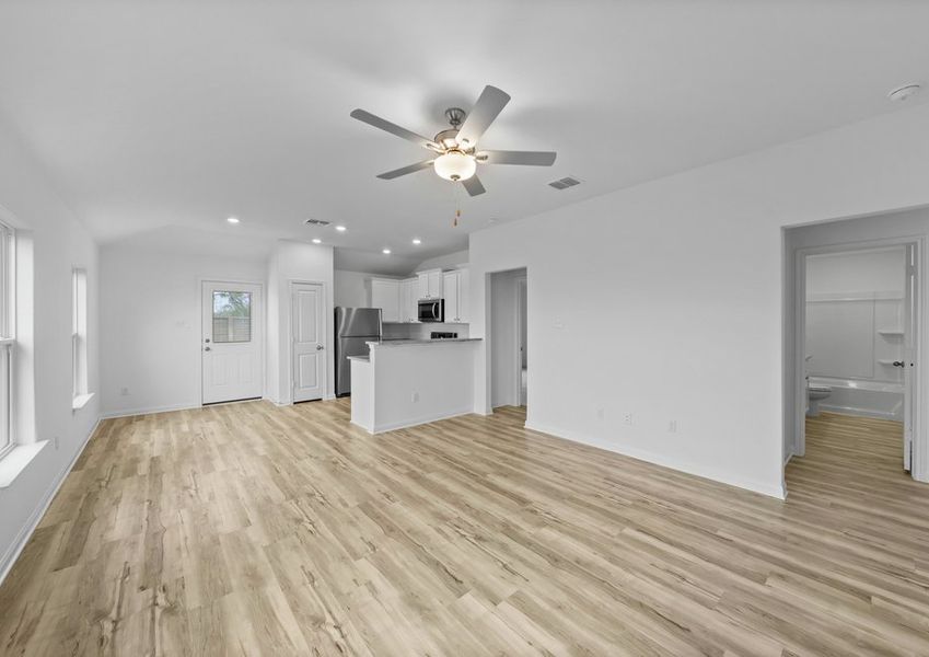 Vinyl flooring throughout the family room and kitchen