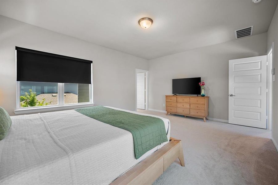 Carpeted bedroom with baseboards Carpeted bedroom with baseboards