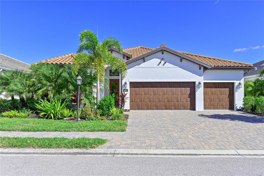 Front exterior of a new home in , Sarasota, FL, highlighting curb appeal (Image 1).