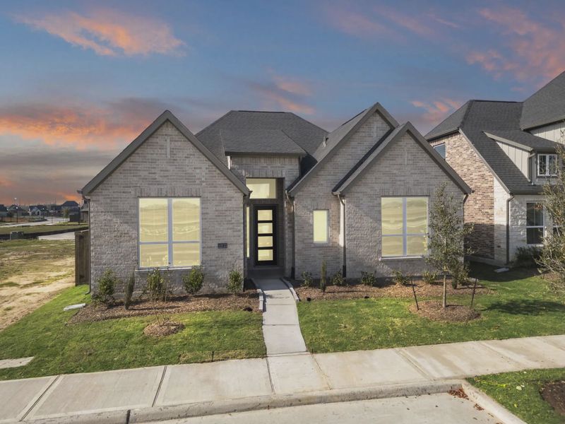 Representative exterior photo of a completed home built from the Nicklaus by Chesmar Homes in Riceland Alley Loads, Mont Belvieu, TX (Image 30).