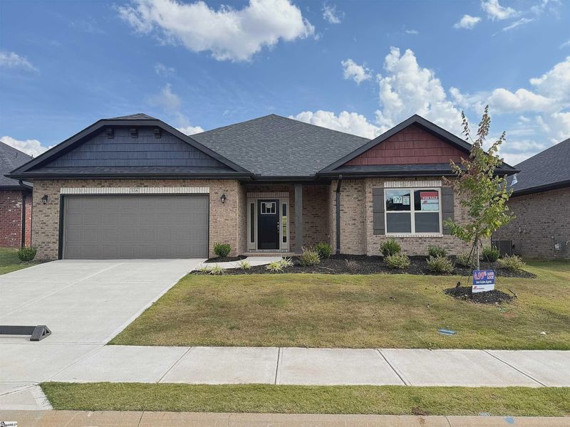 Front exterior of a new home in Bracken Woods, Piedmont, SC, highlighting curb appeal (Image 1). Front exterior of a new home in Bracken Woods, Piedmont, SC, highlighting curb appeal (Image 1).